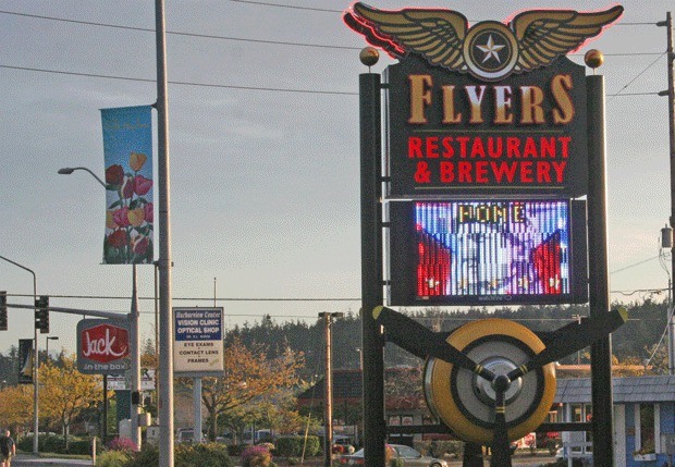 Digital signs like the one advertising Flyers Restaurant have sprung up around Oak Harbor.