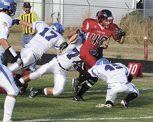 Coupeville's Brett Arnold (40) plows through the Orcas Island defense for the Wolves' first score Friday.
