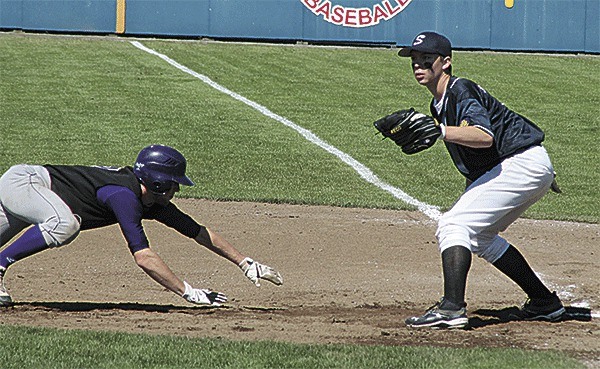 Koby Cosper scrambles back to first in an attempted pick off play against Snohomish.