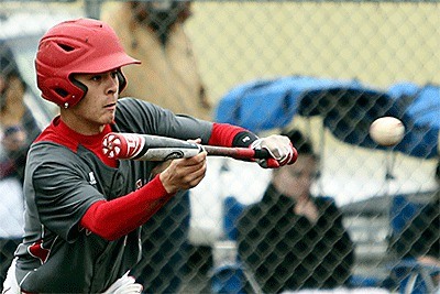 Hunter Smith drops down a sacrifice bunt for the Wolves.
