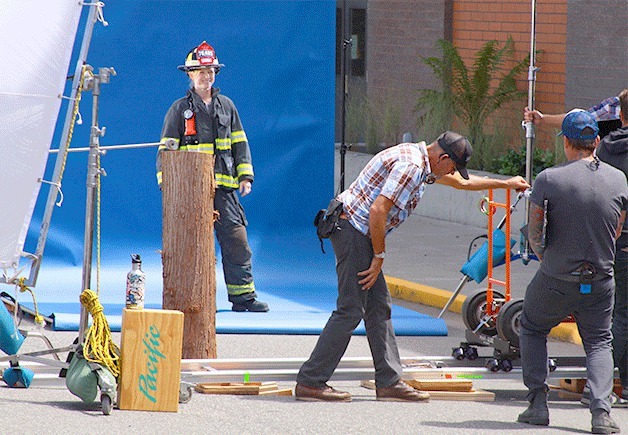 A film crew shoots a scene for an Alaska Airlines commercial just outside the Coupeville High School gymnasium Thursday.