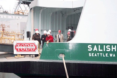 Sen. Mary Margaret Haugen crashes a champagne bottle over the hull of the Salish Wedneday at Todd Pacific Shipyards in Seattle. She promises the boat will serve the Coupevlle to Port Townsend route