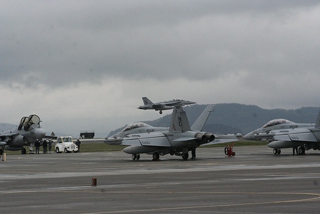EA-18G Growlers of VAQ-130 return to Whidbey Island Naval Air Station after deployment abroad. Congress is still developing a budget that may include the funding for more Growlers.