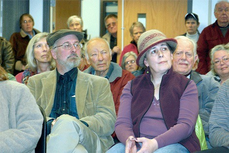 Lance Loomis and Paula Spina listen to comments made by neighbors during a meeting Thursday afternoon to discuss concerns about events taking place at the Crockett Barn