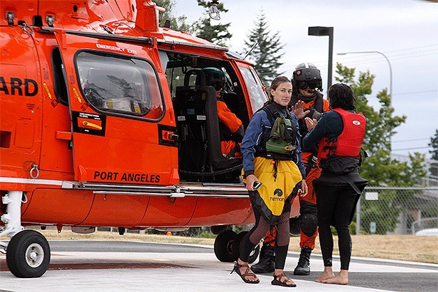 A Coast Guard helicopter lets out two kayak instructors at Whidbey General Hospital Thursday. The instructors and seven children were rescued by Coast Guard and Navy personnel and transported to the hospital after they were separated while kayaking near Deception Pass. No one was hurt.