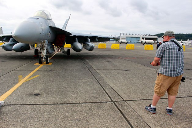 Andrew Kolstad of Tacoma snaps a photo of an EA-18G Growler from the Electronic Attack Squadron (VAQ) 139 Cougars.