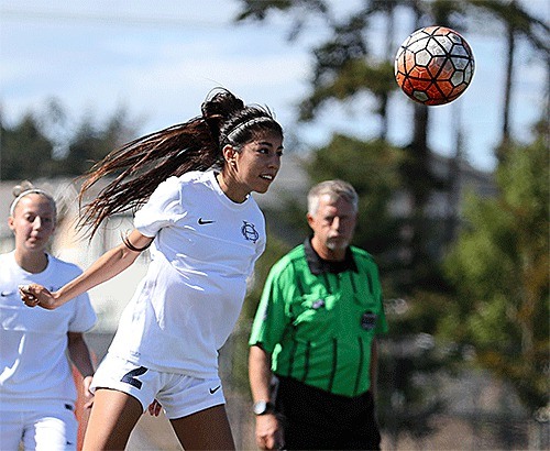 Lenika Aguilar heads the ball for the Wildcats Saturday. Aguilar scored three goals in Oak Harbor's 6-1 win.