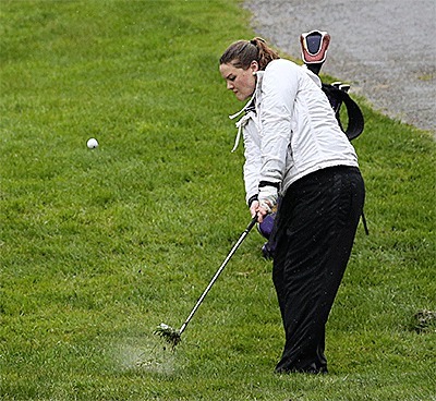 Terra Baird chips out of the rough on the way to earning medalist honors Tuesday.