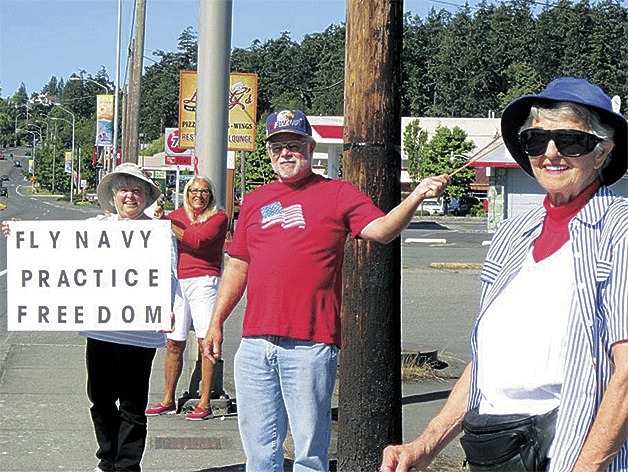 Supporters of the Navy and its operations at Outlying Field Coupeville rallied at the corner of Pioneer Way and State Highway 20. A second rally is planned 10 a.m. today