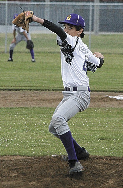 Oak Harbor relief pitcher Corey Roberts eyes his target in Friday's game.
