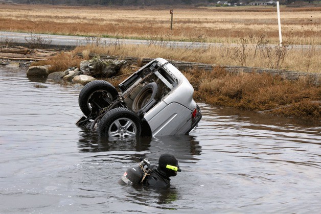A diver had to swim 35 to 45 feet down into a pond Monday morning to find a car that plunged into the water over the weekend. The driver of the car was uninjured.