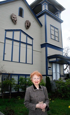 Treva Carter stands in front of the 30-year-old Whidbey Playhouse