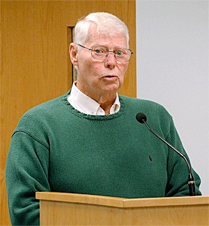 North Whidbey resident Bill Strowbridge addresses the Island County Commissioners Monday with an ordinance meant to be “tongue in cheek” to another proposal that seeks to establish a petition process for no shooting areas.