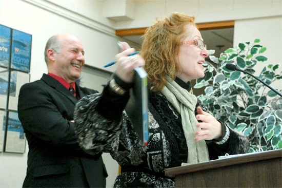 City Administrator Paul Schmidt listens as Lesley McConnell speaks to the city council in March. McConnell was hired to lead the SE Pioneer Way marketing effort but agreed to a mutual termination Wednesday following squabbles over the budget and the marketing focus.