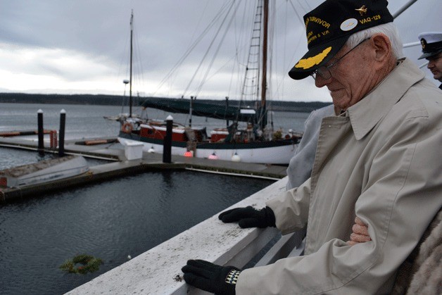 Pearl Harbor survivor Cecil Calavan bows his head in prayer following a wreath-laying ceremony to commemorate the 71st anniversary of the attack on Pearl Harbor.