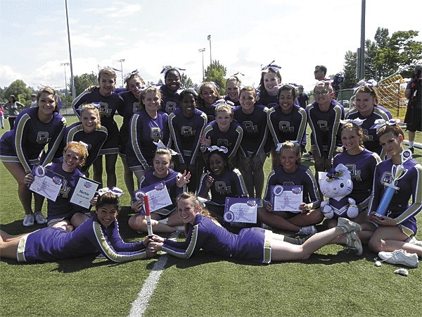 The Wildcat cheerleaders display their many awards from camp. Front from left: Jadie Groebli and Rebecca White. Second row: Jillian White
