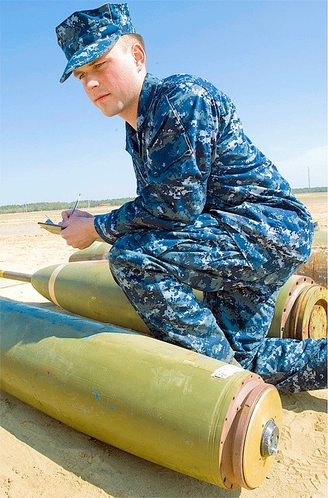 Navy Seaman Apprentice Anthony J. Yockey of Oak Harbor identifies and classifies bombs at Naval School Explosive Ordnance Disposal