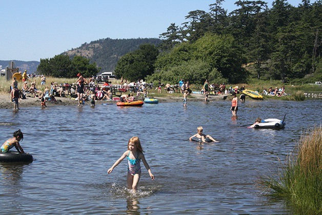 Cranberry Lake at Deception Pass State Park is filled with swimmers Thursday.