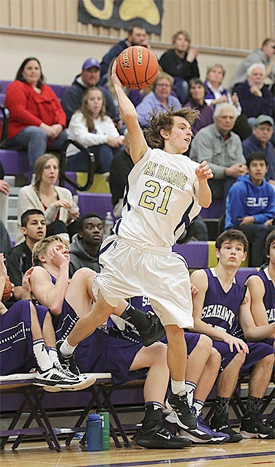 Oak Harbor's Adam Nelson saves a ball from going out of bounds in Saturday's game with Anacortes.