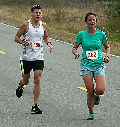 Oak Harbor's Johnathon Janowiecki and Coupeville's Laura Luginbill were the leading local finishers in the Race the Reserve half marathon Saturday.
