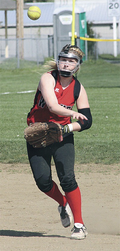 Shortstop Madi Roberts tosses to first Wednesday. Roberts had three hits in the Wolves' loss to Cedarcrest.