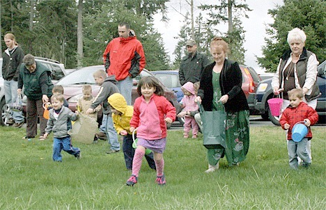 Children race to collect eggs during the annual North Whidbey Firefighter Association Easter egg hunt at the Taylor Road Fire Station. More than 2