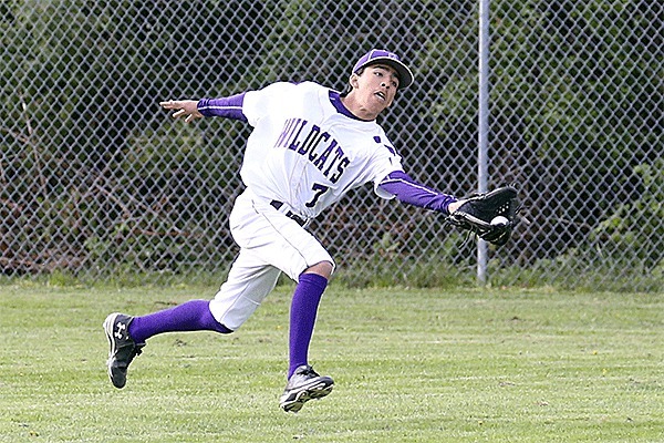 Right fielder Caleb Fitzgerald runs down a fly ball in Wednesday's game.