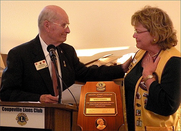 Mayor Nancy Conard is presented the Lions Melvin Jones Fellowship by Dur Roberson.