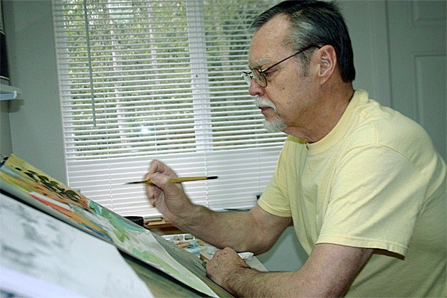 Randy Emmons works on a painting in the studio at his house. His 2013 calendar and book of paintings are available now at Island Drug and Garry Oak Gallery in Oak Harbor and the Penn Cove Gallery in Coupeville.
