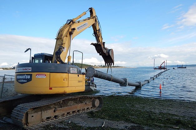 A 24-inch HDPE outfall pipeline is moved into the harbor in Oak Harbor. The project is being built in conjunction with the sewage treatment plant.