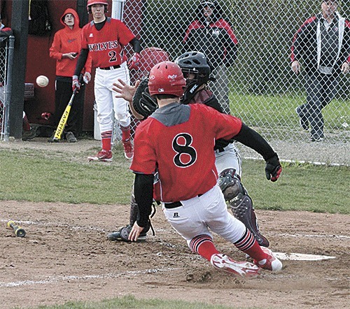 Coupeville's Aaron Trumbull scores on a squeeze bunt by Korbin Korzan in the Wolves' 1-0 win Monday.