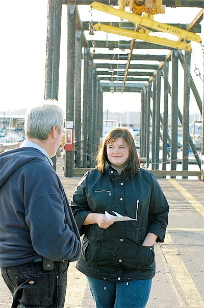 Oak Harbor Marina Harbormaster Chris Sublet speaks with Terica Taylor on a recent tour of the marina. Taylor owns Deception Pass Tours and is considering starting a gray-whale watching business in Oak Harbor.