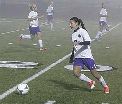 Rebecca Pabona runs down the ball in Oak Harbor's match with Marysville Getchell Thursday.