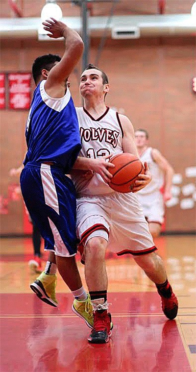 Coupeville's Aaron Trumbull fights by Chimacum's Victor Hitt Friday.