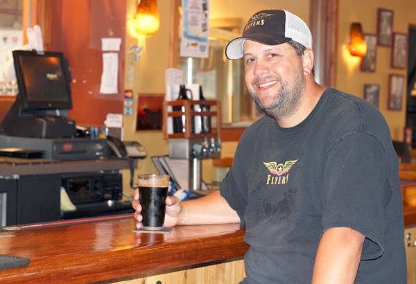 Tony Savoy enjoys a Pacemaker Porter at Flyers Restaurant and Brewery. He developed the recipe for the award-winning ale while his assistant brewer