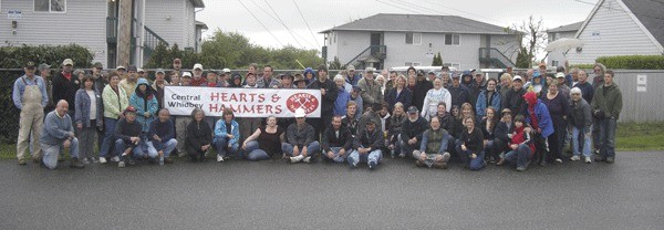 Central Whidbey Hearts & Hammers volunteers assemble for their repair blitz for homeowners in need.