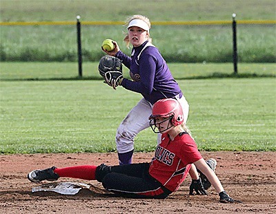 Coupeville's Hope Lodell slides in safely at second while Concrete's Iris Nevin checks another runner.