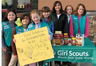Oak Harbor Girl Scouts thank the residents of Oak Harbor for their generous donations of 1