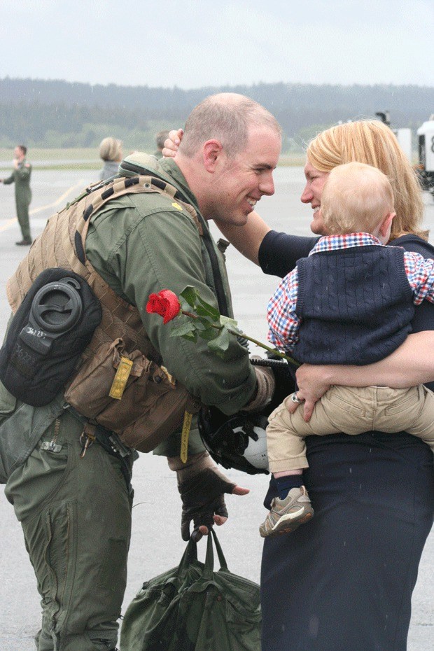 Lt. Cmdr. Jim Grant returns home after a nine-month deployment to his wife