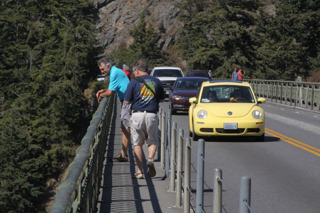 Visitors take in the view from the Deception Pass Bridge Thursday