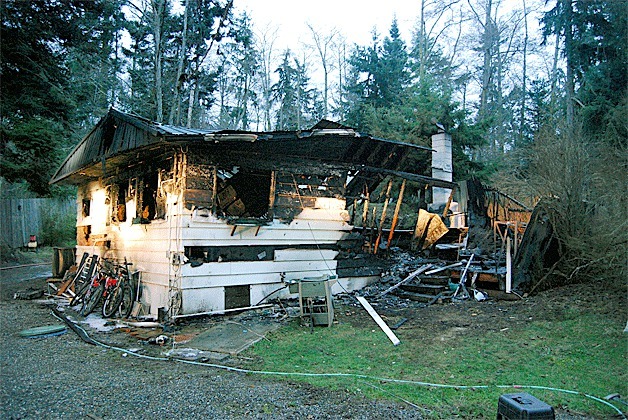 A Smuggler’s Cove Road home lies in ruin after being destroyed by an early morning fire Friday