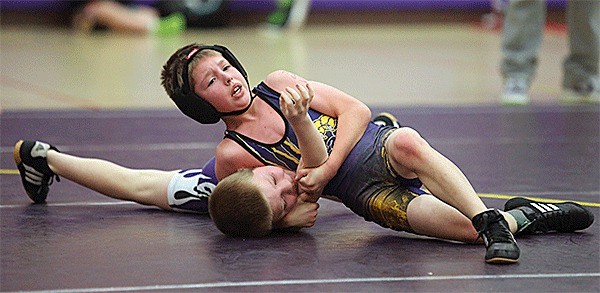 WWWC's Parker Anderson turns Anacortes' Mahki Oakley in the title match. Anderson won 9-7.