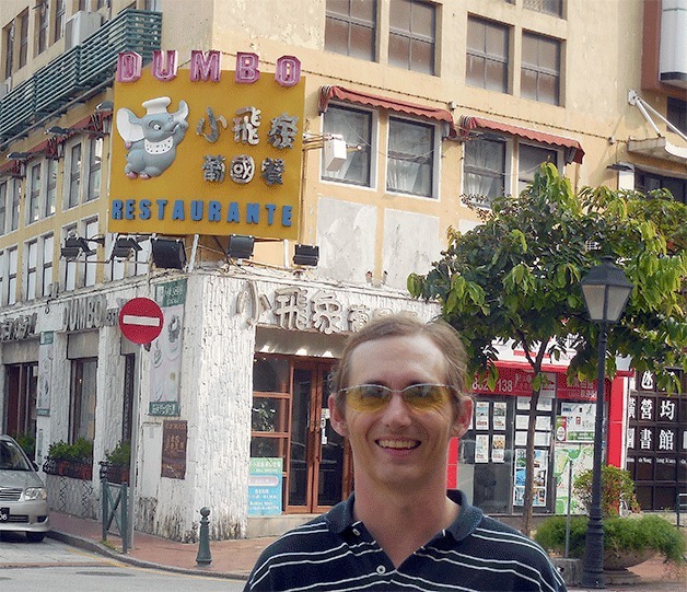 Former Clinton resident Michael Farrens gets his photo taken on a street in China. He’s wanted on a $10