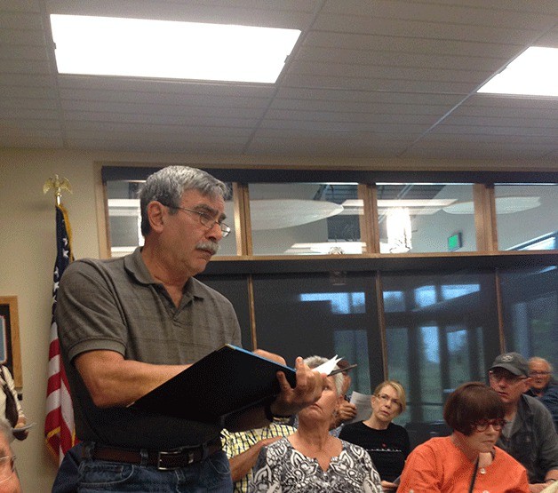 Jeff Lauderdale questions the Island County Transit Board Friday about the agency’s expenses and revenues.