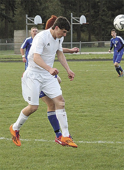 Coupeville's Tanner Kircher uses his head to direct the ball in the Wolves win over South Whidbey Friday.