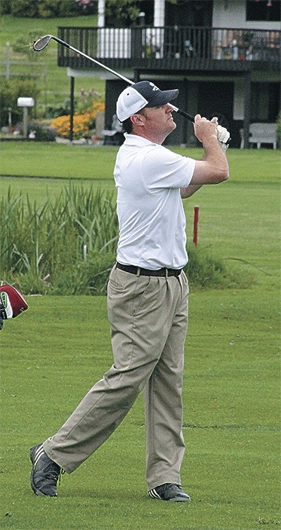 Doug Piece watches his shot at the Whidbey Men's Invitational Sunday.