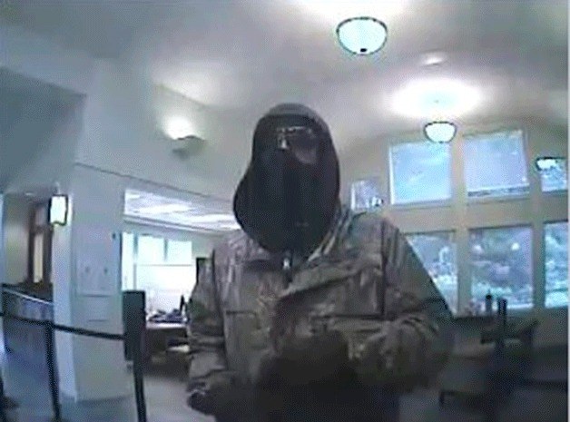 This still image was taken from surveillance footage at the Wells Fargo bank in Clinton. Police say an armed man