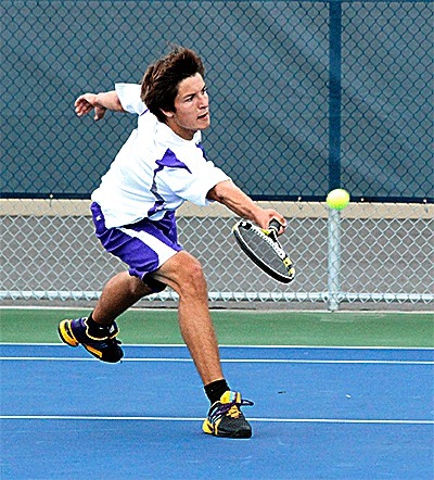 Oak Harbor's Tom Dale hustles to return a shot from his Stanwood opponent.
