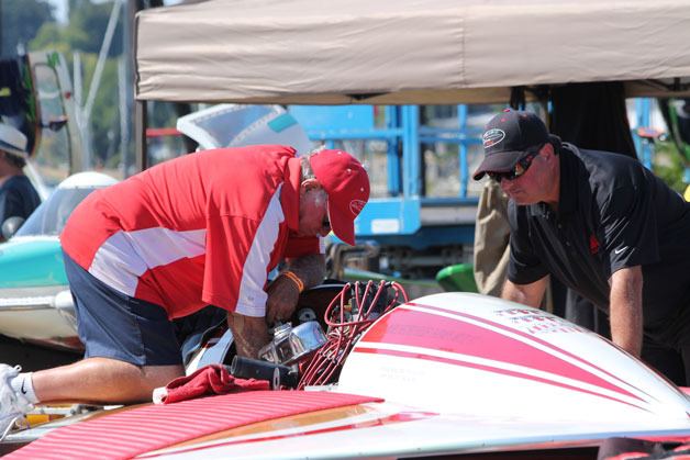 A pit crew readies a hydroplane between races at last year’s event.