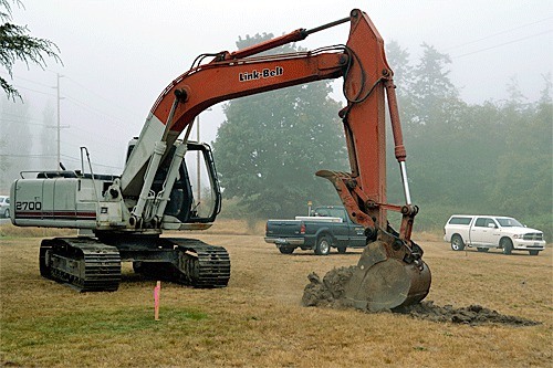 A backhoe breaks ground for the A-3 Skywarrior Whidbey Memorial Sept. 20 at Ault Field Road and Langley Blvd.